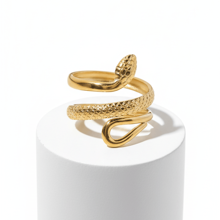 Gold Snake Wrap Adjustable Ring on white pedestal