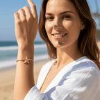 Women wearing Gold Starfish Bangle Bracelet on beach