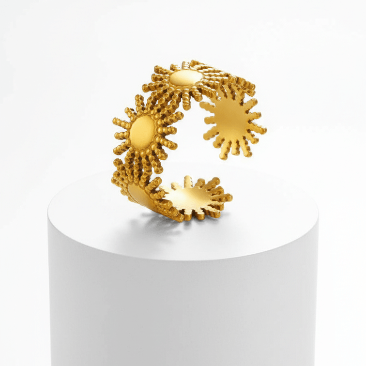 Gold Sunburst Adjustable Ring on white pedestal