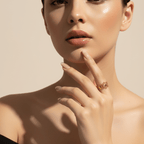 Woman wearing a Gold Sunburst Adjustable Ring on her finger against a beige background