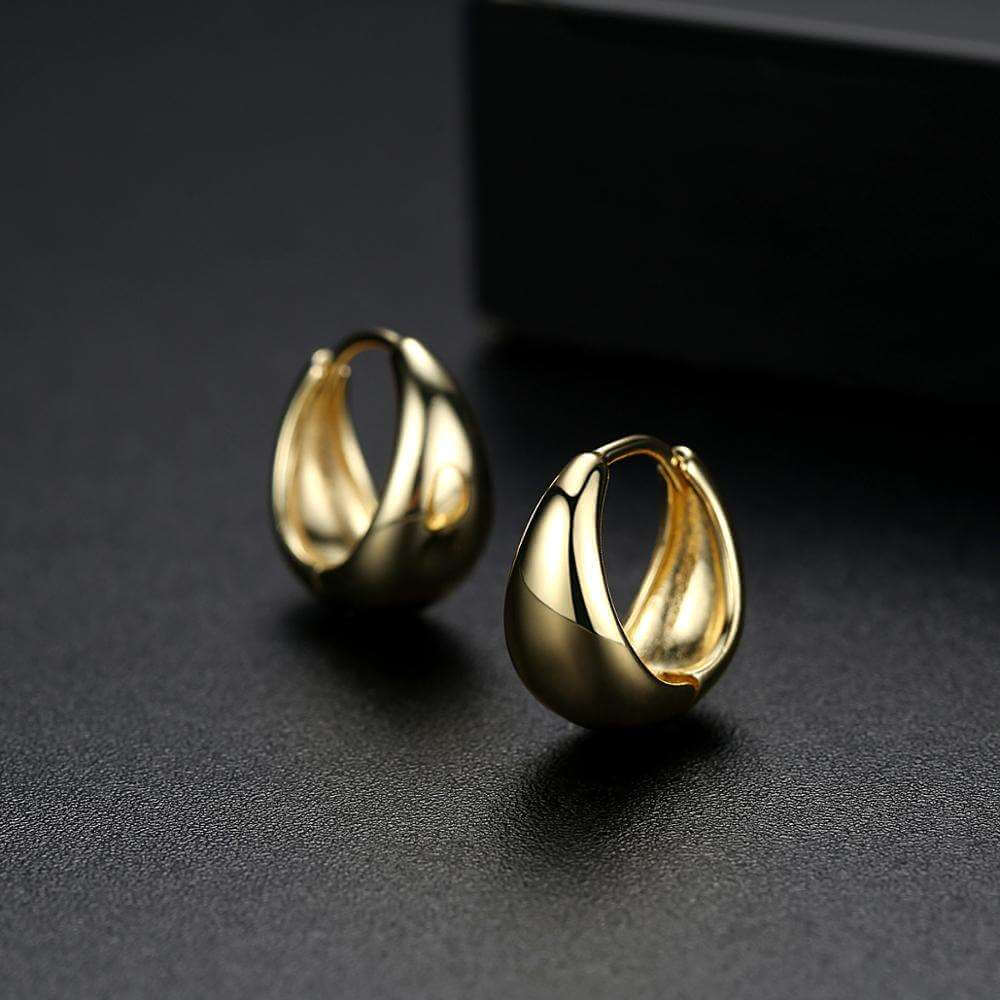 Gold Teardrop Mini Hoop Earrings on black background