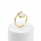 Gold Teardrop Wrap Ring featuring a smooth white teardrop centerpiece on a polished gold-tone frame.