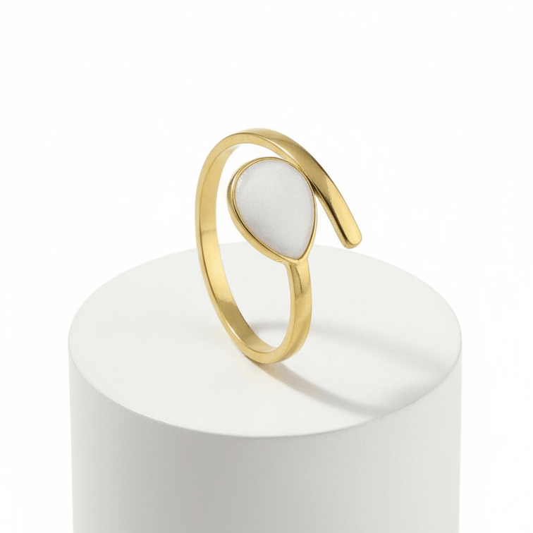 Gold Teardrop Wrap Ring featuring a smooth white teardrop center and an adjustable gold-tone frame.