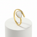 Gold Teardrop Wrap Ring featuring a smooth white teardrop center and an adjustable gold-tone frame.