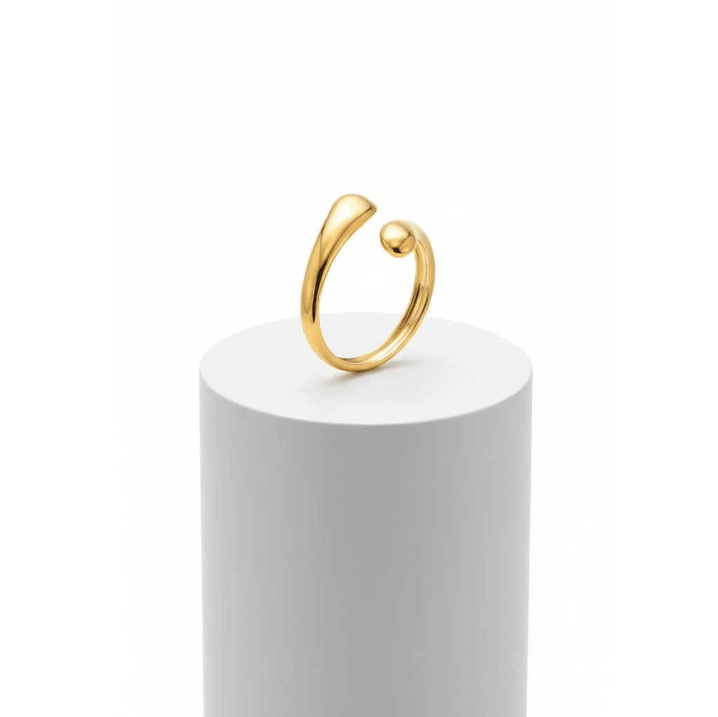 Gold Teardrop Sculptural Ring on white pedestal