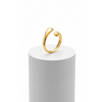 Gold Teardrop Sculptural Ring on white pedestal