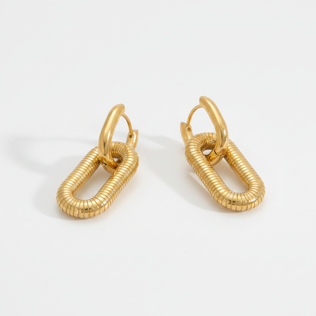 A pair of Gold Textured Oval Link Hoop Earrings, photographed on a clean white background.