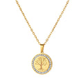Gold Tree of Life Gemstone Necklace displayed against a warm plain background