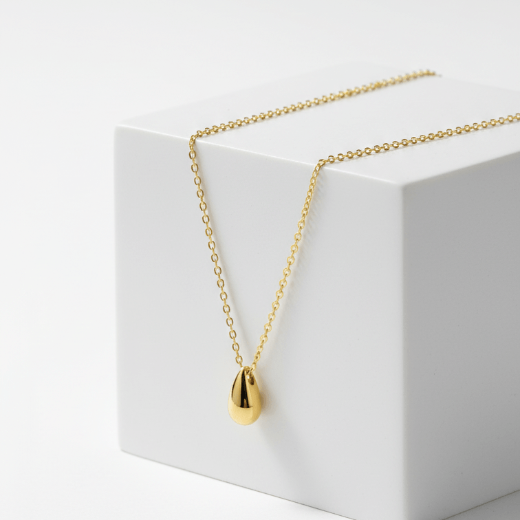 Gold Water Drop Necklace on a white box