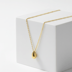 Gold Water Drop Necklace on a white box