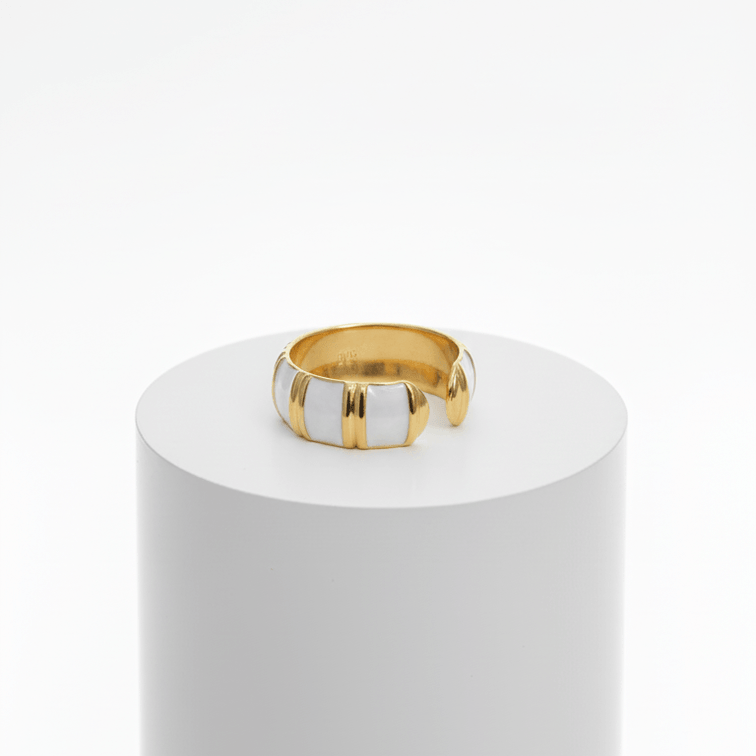 Gold White Inlay Adjustable Ring on a white cylindrical stand against a white background