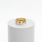 Gold White Inlay Adjustable Ring on a white cylindrical stand against a white background
