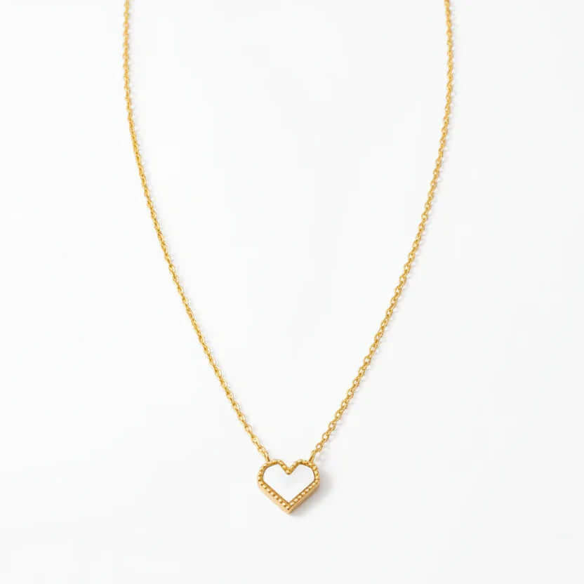 Gold heart-shaped pendant necklace on delicate chain, Ceyrah jewelry