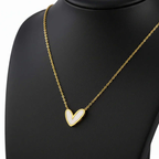 Gold heart-shaped necklace on display, Ceyrah jewelry elegant pendant chain