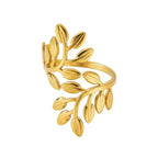 Ceyrah gold leaf-shaped ring with delicate branch design on white background