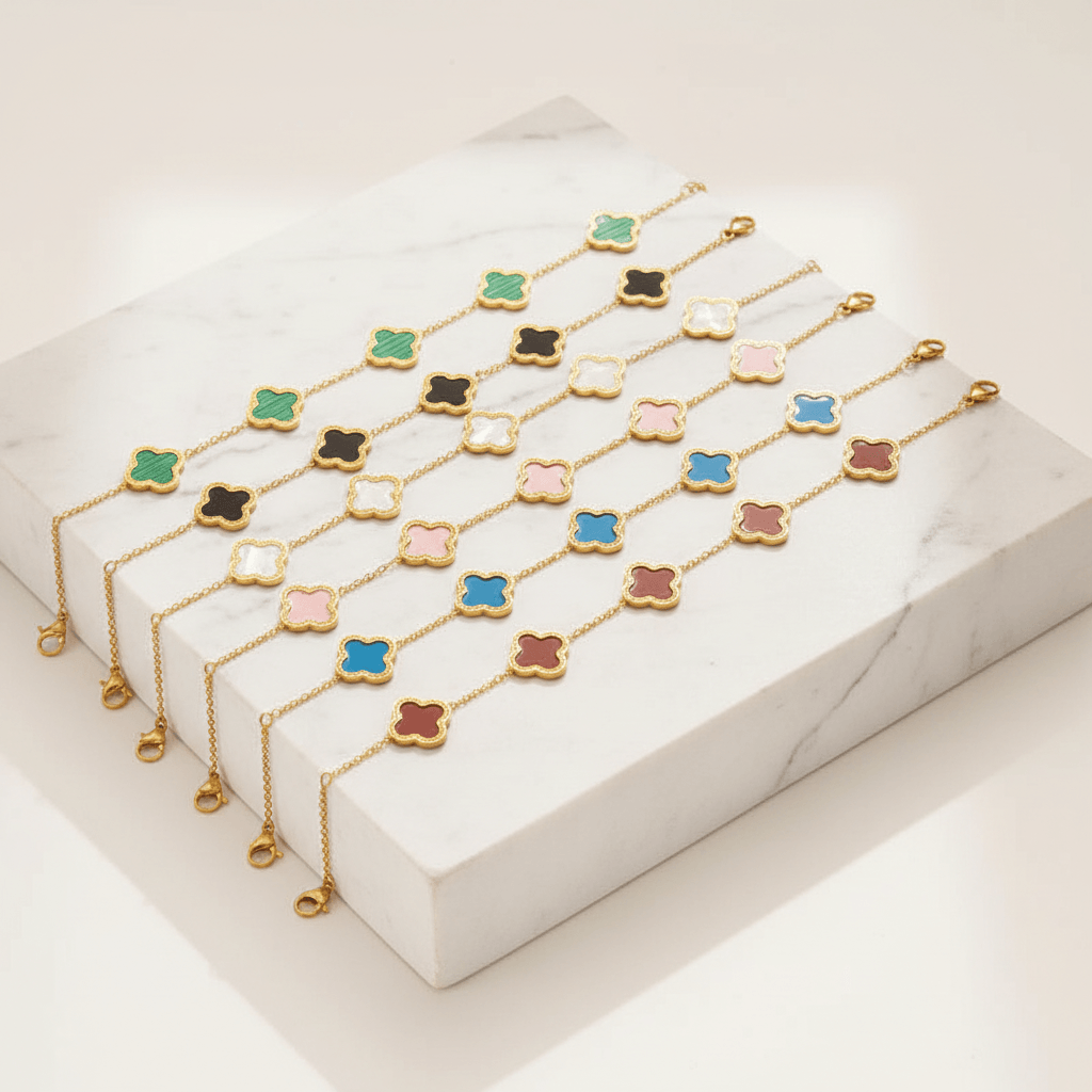 Ceyrah gold clover enamel bracelets in green, black, white, pink, blue, and red on display