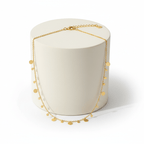 Ceyrah gold coin charm necklace on delicate chain, minimalist jewellery on pedestal 