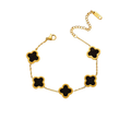 Ceyrah gold chain bracelet with black four-leaf clover charms on white background