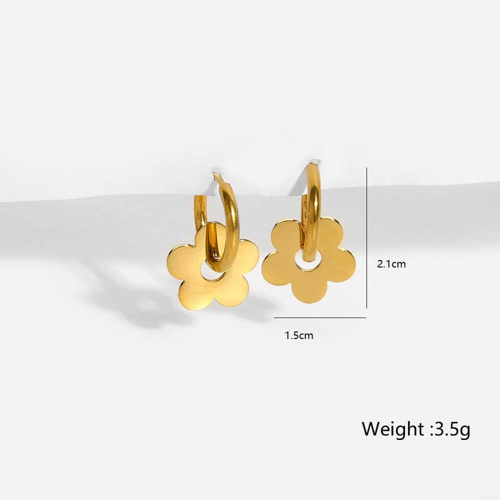 Ceyrah gold hoop earrings with flower-shaped charms on light background with measurements 