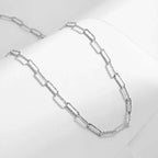 Ceyrah silver paperclip chain necklace on white background, minimalist jewelry
