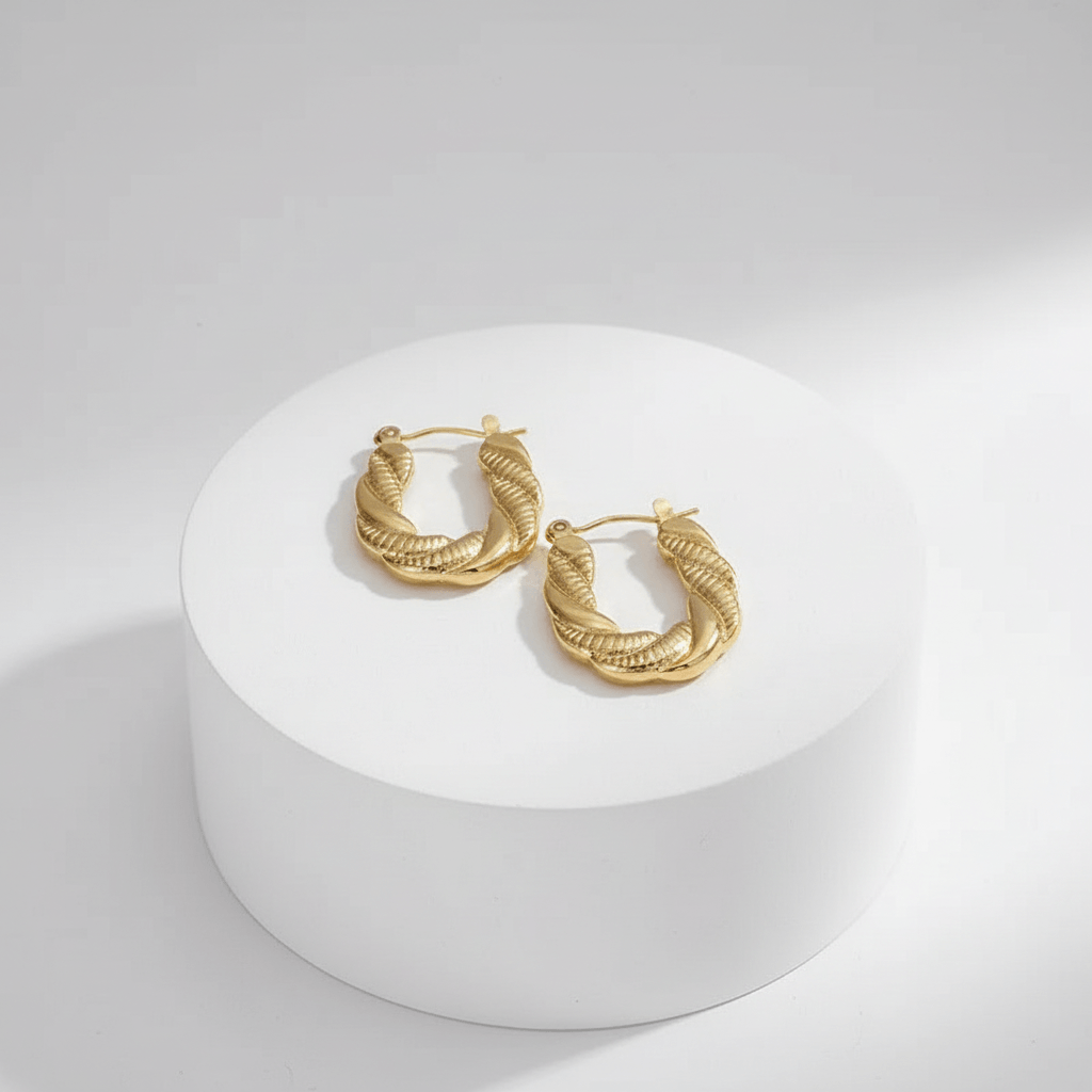 Gold Twisted Rope Hoop Earrings  on a white pedestal