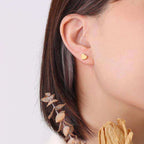 women wearing Ceyrah gold stud earrings