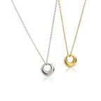 Mini Gold Circle Pendant Necklace displayed in gold and silver options on delicate chains.