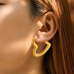 Gold hoop earrings on a model