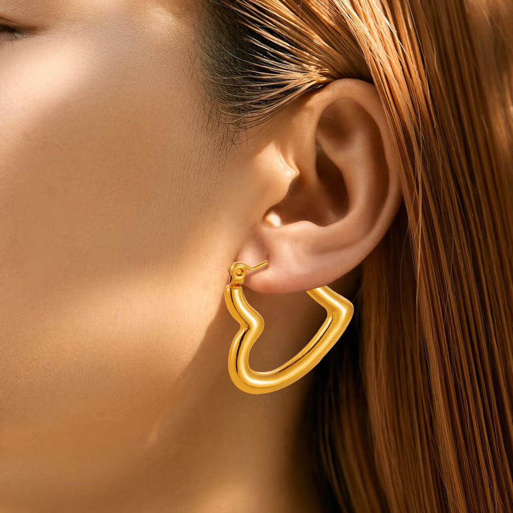 Gold hoop earrings on a model