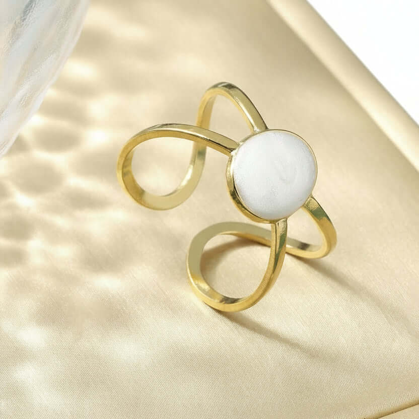 Gold Adjustable Pearl Ring with a pearl on a surface