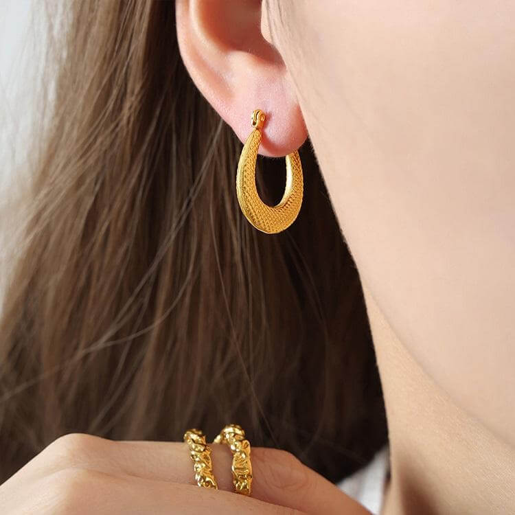 Textured Gold Crescent Hoop Earrings worn by women.