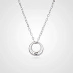 Mini Gold Circle Pendant Necklace on a delicate chain featuring a sleek open ring charm.