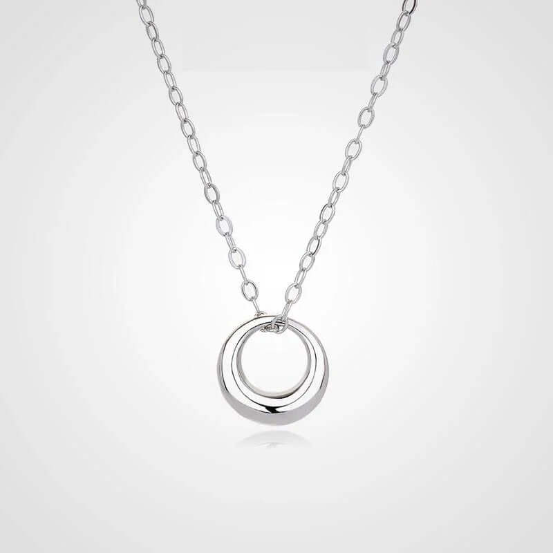 Mini Gold Circle Pendant Necklace on a delicate chain featuring a sleek open ring charm.