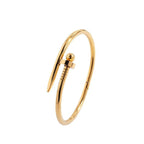 Bread Nail Bangle Bracelet in 18k gold plated stainless steel for a modern look and stylish elegance.