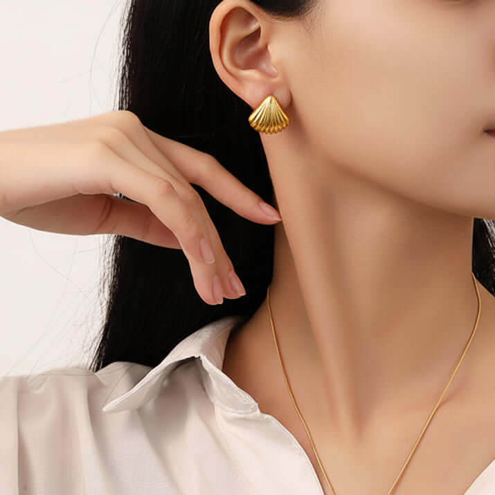 Ceyrah - Gold Shell Ribbed Stud Earrings worn by women