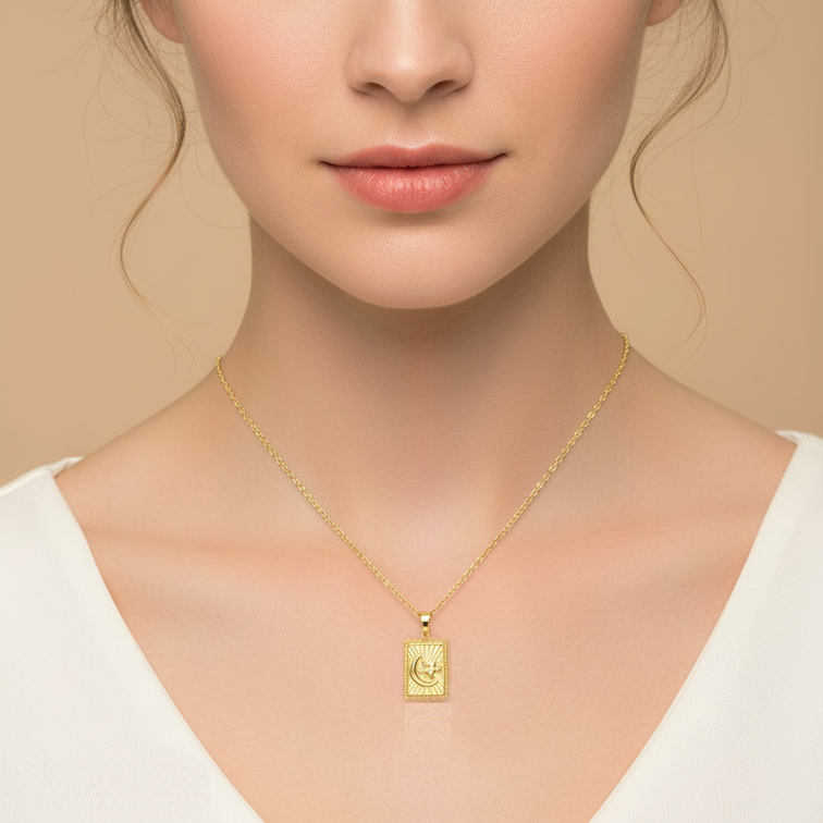 A close-up portrait of a woman with brown hair in an updo, wearing a delicate gold chain necklace with a small rectangular pendant, set against a warm beige background.