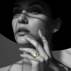 Gold Ridged Open Band Ring worn elegantly on a model's hand with dramatic shadows and a stylish hat.
