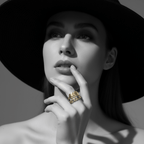 Woman wearing Gold Leaf & Chain Adjustable Ring, highlighting its delicate design and bold elegance.