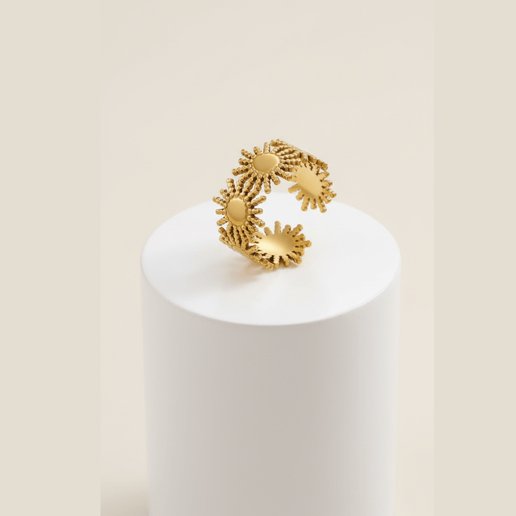 Gold Sunburst Adjustable Ring on pedestal