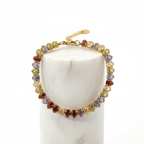 Gold Colour Gemstone Bracelet featuring colorful jewel-tone beads on a polished gold chain.