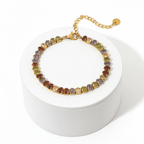 Gold Colour Gemstone Bracelet featuring jewel-tone beads and a polished gold chain on a display box.