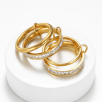 Four Layered Gold Eternity Ring showcasing polished gold bands and clear square-cut stones.