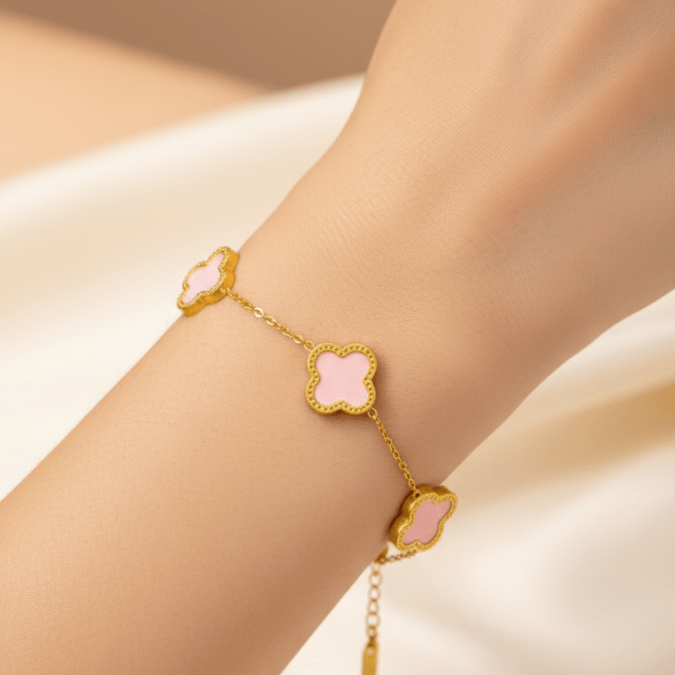 Gold bracelet with five clover-shaped white inlays on delicate chain, Ceyrah jewelry