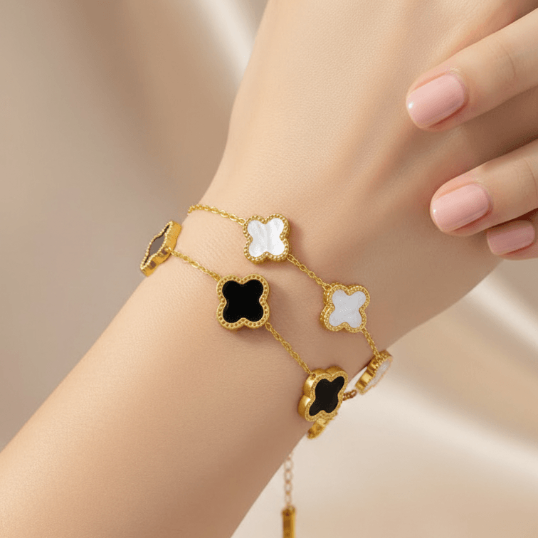 Gold bracelet with five clover-shaped white inlays on delicate chain, Ceyrah jewelry