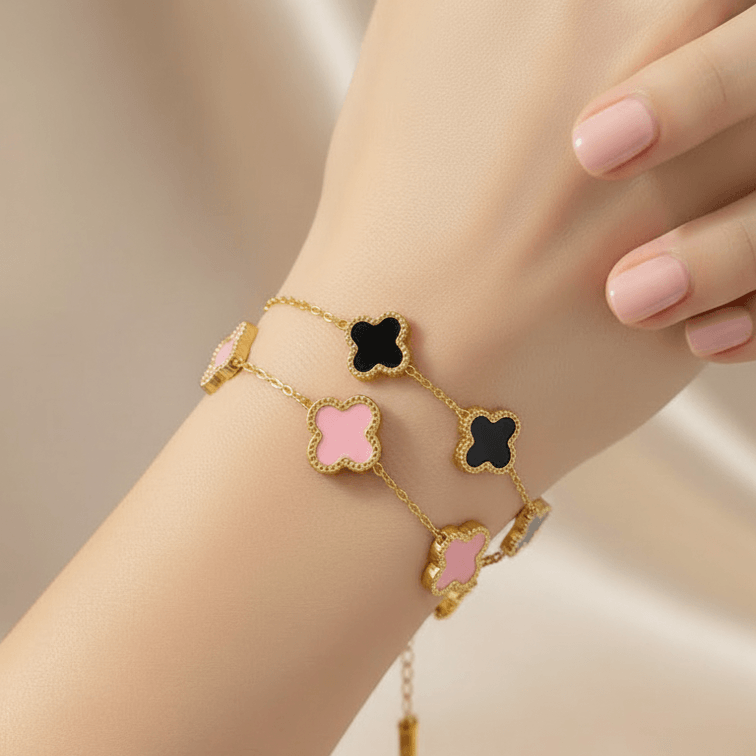 Gold bracelet with five clover-shaped white inlays on delicate chain, Ceyrah jewelry