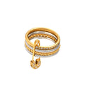 Layered Gold & Silver Safety Pin Ring with a decorative element on a white background