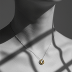 Mini Gold Circle Pendant Necklace worn on a delicate chain, featuring a sleek open ring charm elegantly displayed.