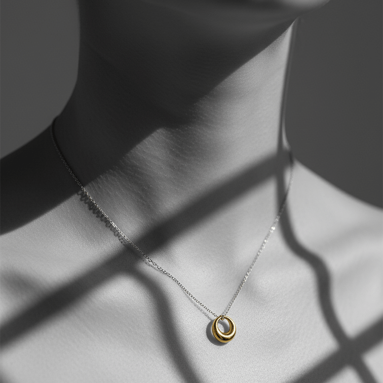 Mini Gold Circle Pendant Necklace worn on a delicate chain, featuring a sleek open ring charm elegantly displayed.