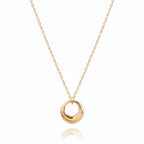 Mini Gold Circle Pendant Necklace featuring an open ring charm on a delicate gold chain.