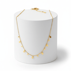 Mini Teardrop Charm Necklace on round pedestal